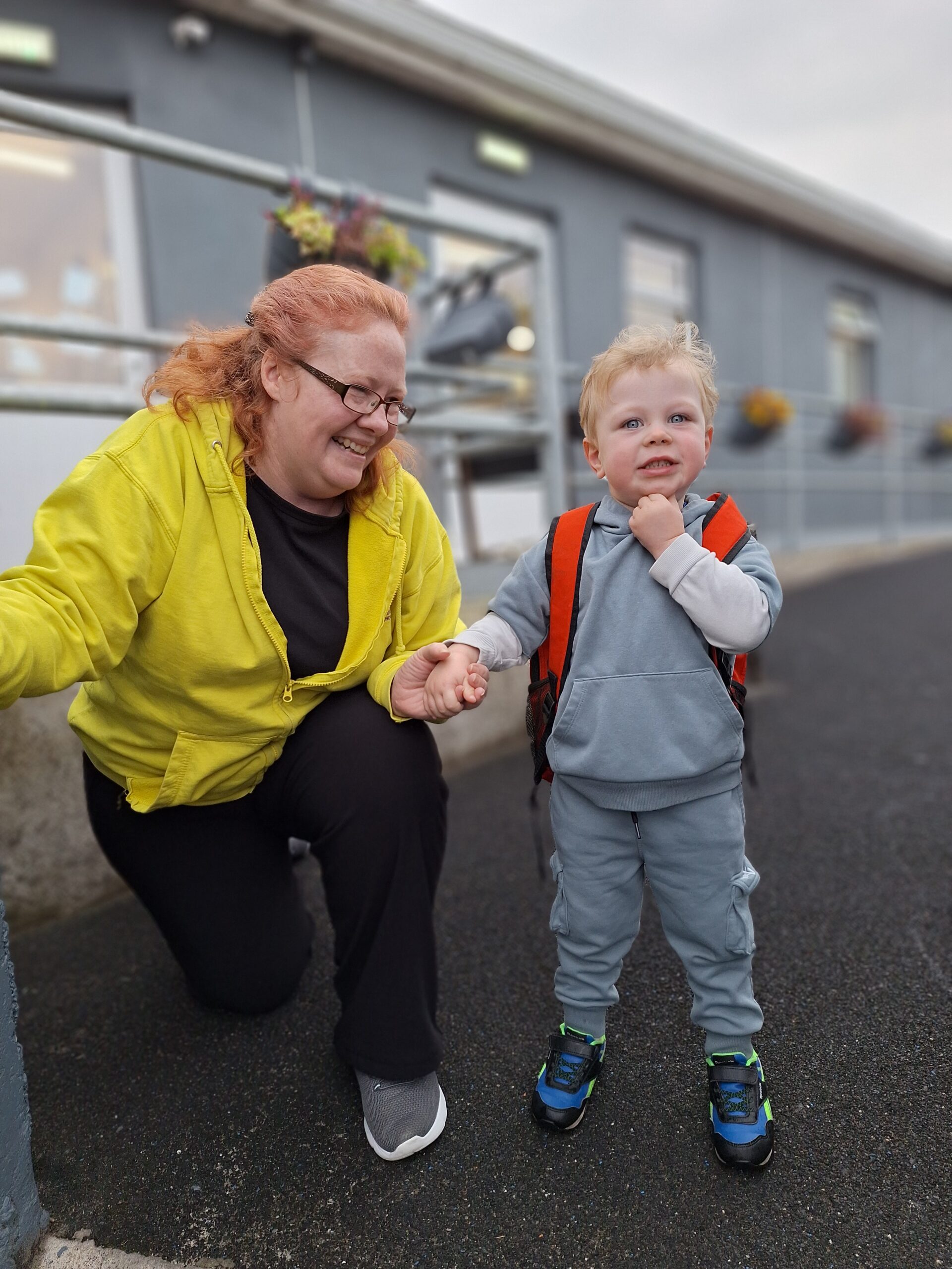 Young child with a backpack preparing for preschool or primary school