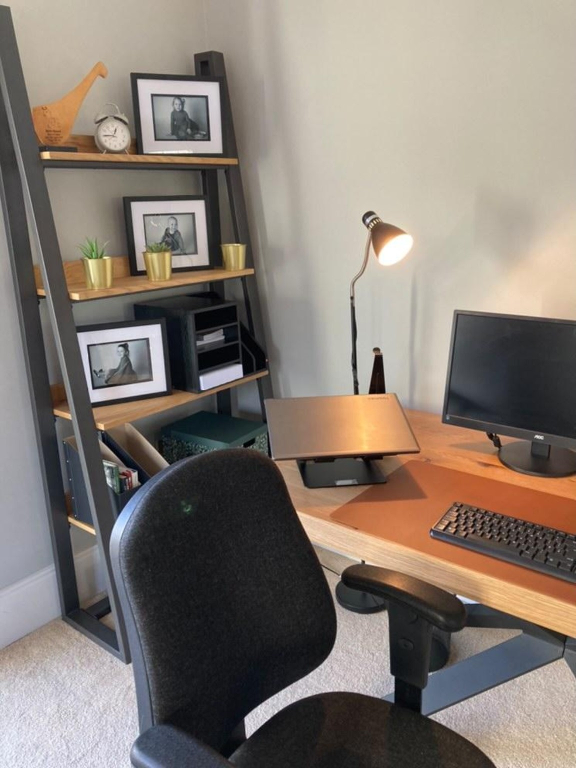 Adult working at an organised home workstation.